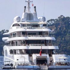 a large white boat floating on top of a body of water