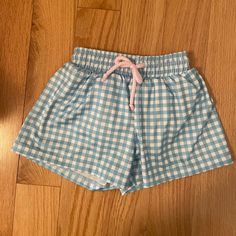 Nwt And Never Worn. Blue Gingham Swim Shorts. Mesh Lining And Drawstring Closure. Cotton Gingham Pajama Shorts With Elastic Waistband, Playful Blue Cotton Pajama Shorts, Plaid Cotton Beach Bottoms, Blue Cotton Shorts For Sleepover, Cute Light Blue Cotton Bottoms, Blue Cotton Shorts For Sleepovers, Blue Summer Bottoms For Playtime, Summer Blue Bottoms For Playtime, Cute Blue Shorts For Playwear