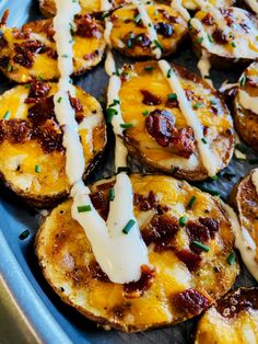 baked potatoes with cheese and sauce in a pan