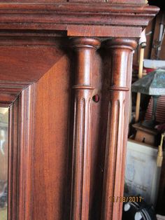 an old wooden grandfather clock in a shop