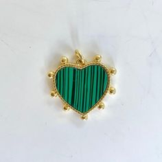 This cute charm is a wonderful eye catcher by itself or added to layering necklaces. Charm 23.4x21.7mm GF Malachite Green, Layering Necklaces, Cute Charms, Heart Charm, Layered Necklaces, Layering, Necklaces, Wonder, Green