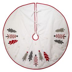 a round christmas tree skirt with red trimmings and trees on the bottom, hanging from a string