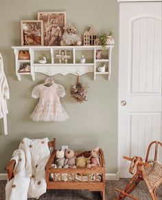 a baby's room is decorated in pink and white