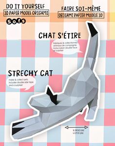 an origami paper model of a cat on a checkered tablecloth background