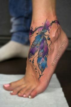 a woman's foot with a tattoo design on it