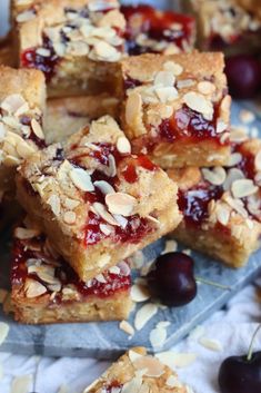 several pieces of cherry almond bars stacked on top of each other