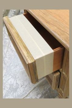 a close up of a wooden desk with drawers