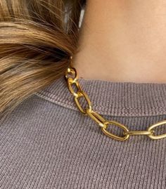 The Ava necklace is a truly timeless piece. This stunning Gold Plated Chain Necklace was lovingly crafted to add a splash of elegance to any outfit, perfect to add to a school or work outfit!  Product Details: Material: High-quality gold plating over an aluminum base Chain Dimensions: Each link measures 16mm in length, 8mm in width, and 1.8mm in thickness Why You'll Love It: Bold & Beautiful: With its luxurious wide links, this necklace is a statement piece that catches the eye and elevates your style. Versatile: Whether you're dressing up for a special occasion or accessorizing a casual look, this necklace transitions effortlessly. Lasting Shine: Crafted to withstand the test of time, the gold plating ensures a lasting finish that resists tarnishing and maintains its color and shine. Perf Classic Metal Chain Necklace For Gift, Classic Metal Chain Necklace For Everyday, Trendy Gold Plated Chain Necklace For Formal Events, Trendy Gold Plated Chain Necklace For Formal Occasions, Adjustable Chain Necklace For Workwear, Trendy Everyday Metal Chain Necklace, Trendy Everyday Gold-tone Necklaces, Trendy Metal Chain Necklace For Everyday, Trendy Everyday Gold-tone Necklace