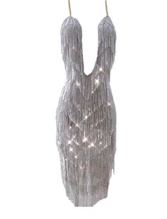 Rhinestone tassel see trough dress with an open back. Glamorous Fringe Club Dress, Glamorous Club Dress With Tassels, Summer Club Dresses With Rhinestone Fringe, Backless Fringe Dress For Night Out, Glamorous Tassel Dress For Night Out, Glamorous Backless Fringe Dresses, Elegant Backless Fringe Mini Dress, Club Sleeveless Dress With Rhinestone Fringe, Sleeveless Club Dress With Rhinestone Fringe