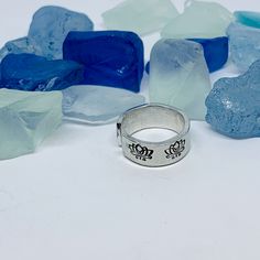 If you love flowers and/or being outdoors, this ring is perfect for you!Lotus flower(s) adorn this hand crafted slightly adjustable toe or finger ring. Indicate finger size at check out. I personally hand stamp all of the lettering and designs in my NJ studio. Each letter and design is hand aligned and hammered into the metal, so the placement of the wording and designs will vary slightly from piece to piece. After stamping, I darken the impressions so they stand out. To retain the contrast, it Mother Daughter Rings, Daughter Ring, July Birth Flower, Hand Stamped Metal, Ring Finger, One Ring, Toe Rings, Flower Ring, Lotus Flower