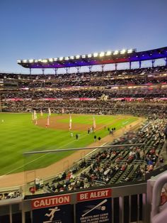 a baseball stadium filled with lots of people