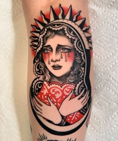 a woman's arm with a tattoo on it and a heart in the middle