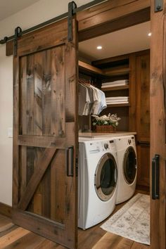 a washer and dryer in a room with wooden doors that lead to the closet