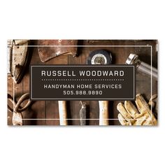 a business card for russell woodward handyman home services with tools on the table