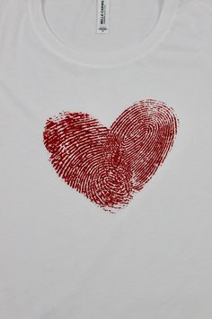 a t - shirt with a fingerprint in the shape of a heart on it