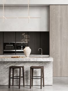 two stools in front of a marble counter top