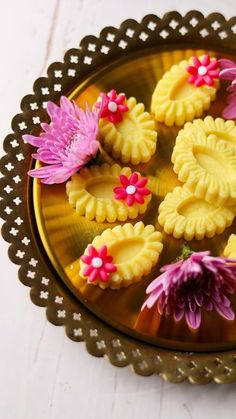 small cookies decorated with flowers on a plate