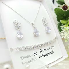 "* Item Description * Necklace Pendant - AAA+ Cubic Zirconia- L 1.5\" W 0.5\" Cubic Zirconia- Luster Rhodium plated .Dainty Chain Total Length 18\" Main chain 16\" - Extension:2\" .Earring - AAA+mCubic Zirconia L- 1 1/4\" (3.3cm) .Bracelet . Leafs (4\")AAA+ Cubic Zirconia Bracelet. . Adjustable Bracelet. . Total Length 12\" . Gift Box size (W- 3 4/3 L- 5 1/4) This product come with your choice of jewelry card and gift box. If you want use for other occasion just indicate the card# (W01 F01 etc.. White Cubic Zirconia Dangle Jewelry Set, White Crystal Jewelry Sets As Gift, White Crystal Jewelry Sets For Gift, Adjustable Silver Cubic Zirconia Jewelry Sets, Diamond White Jewelry Set With Sparkling Stones For Gift, White Jewelry Sets With Sparkling Stones For Gift, White Cubic Zirconia Jewelry Sets For Gifts, White Cubic Zirconia Jewelry Sets With Matching Earrings, Cubic Zirconia Bracelet