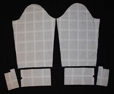 four pieces of white fabric with squares cut out on black background, including one piece missing