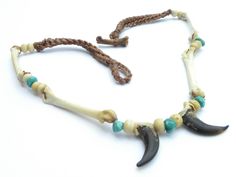 Unique style inspired by Native American Indians Genuine Bobcat bones drilled and tied with artificial deer sinew. Genuine Arizona Turquoise stones and Buffalo bones beads. Real Coyote claws. Available necklace is 18.5 inches long to 22 inches Please check my other items. Please let me know if you have any questions Adjustable Bone-colored Jewelry For Festivals, Adjustable Bone-colored Jewelry For Festival, Adjustable Bone Color Jewelry For Festival, Handmade Western Turquoise Necklace For Festival, Bohemian Bone Colored Jewelry For Festivals, Bohemian Bone-colored Jewelry For Festival, Cowgirl Rodeo, Liminal Space, Arizona Turquoise