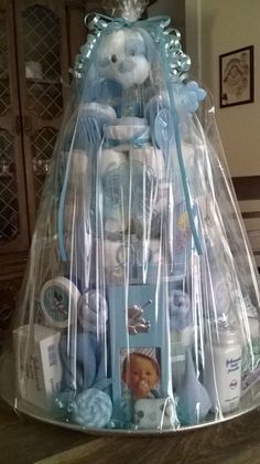 a large basket filled with baby items on top of a table