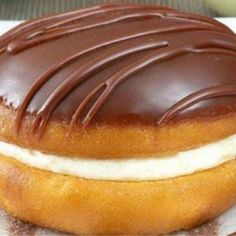 a chocolate covered doughnut sitting on top of a table