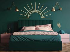 a bedroom with green walls and gold sunbursts on the wall above the bed