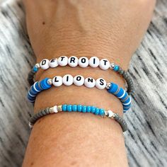 🏈 Who loves football? Are you a Detroit Lions fan? Show your team spirit with this fun bracelet set! Great for gift giving!! Lightweight and oh so comfy to wear. You will receive 3 bracelets that are made on strong stretch cord and made to fit a 7 1/2" wrist. Need a different size? Just let me know your wrist size and I will be happy to custom make for you! Each piece is handmade with: - High Quality Seed Beads - Heishi Vinyl Seed Beads - Silver Accent Beads - White/Black Acrylic Letter Beads - Stretch Cord: high-quality cord with reinforced knots Easily layer with other Luna by Rachel bracelets for a stunning stack! My pieces are made sturdy, but as with all jewelry, they are also delicate and should be treated with care. Be sure to check out other designs in my shop at http://etsy.com/s Detroit Lions Bracelet, Game Day Team Spirit Stretch Bracelet With Round Beads, Blue Beaded Bracelets With Letter Beads For Team Spirit, Blue Beaded Bracelets For Team Spirit Gift, Blue Team Spirit Beaded Bracelets As Gift, Team Spirit Letter Beads Bracelets As Gift, Team Spirit Letter Beads Bracelets For Gift, Game Day Bracelets With Letter And Round Beads, Team Spirit Bracelets With Letter Beads