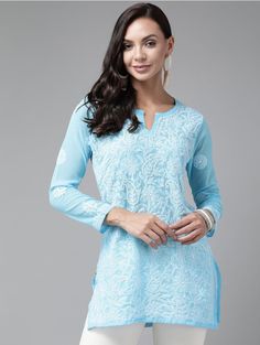 Introducing our enchanting Sky Blue Chikankari Short Kurti, crafted from delicate Georgette fabric! This stunning piece showcases the beauty of Chikankari embroidery and is perfect for those seeking elegance and grace. Please note that the Georgette fabric used in this kurti is intentionally designed to be semi-transparent, adding an ethereal touch to your outfit. To ensure modesty and maintain the intricate details of the Chikankari work, it is essential to wear an inner garment underneath. The model featured in the picture is wearing an inner garment to demonstrate the perfect pairing and provide clarity on the overall look. Please kindly note that the inner garment is not included with the purchase of this kurti. Our Sky Blue Chikankari Short Kurti is a versatile addition to your wardro Spring Blue Georgette Kurta, Blue Straight Kurta Tunic For Spring, Festive Light Blue Kurta With Floral Embroidery, Blue Chikankari Embroidered Straight Kurta, Blue Straight Kurta With Chikankari Embroidery, Blue Chikankari Embroidery Straight Kurta, Blue Straight Kurta Tops For Festive Occasions, Festive Blue Straight Kurta Top, Blue Georgette Blouse Piece With Floral Embroidery