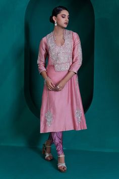 Rose pink chanderi tunic with sequin, badla and silver zari embroidery and pearl lace. Paired with a tulip pant and dupatta.
Components: 3
Pattern: Embroidered
Type Of Work: Zari, Sequin, Badla
Neckline: U Neck
Sleeve Type: Three-quarter
Fabric: Modal Satin, Georgette Organza, Organza
Color: Pink
Other Details: 
Approx. product wieght: 4 -5 kgs
Occasion: Mehendi and Haldi - Aza Fashions Tulip Pants, Pearl Lace, Zari Embroidery, Pearl And Lace, Embroidered Tunic, U Neck, Pant Set, Set For Women, Rose Pink