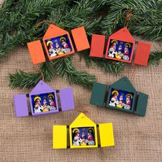 christmas ornament with family pictures hanging from the tree