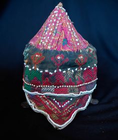 This is a cap from the Swat Valley in Pakistan. The Swat Valley is know for it's beautiful silk embroidered textiles. It is made of a cotton fabric embroidered in silk and decorated with glass and metallic beads. -Silk embroidery -Glass and metallic beads -Swat Valley Traditional Multicolor Embroidered Fabric For Ceremonial Use, Ceremonial Multicolor Embroidered Raw Silk Fabric, Ceremonial Multicolor Embroidered Fabric, Multicolor Embroidered Fabric For Ceremonial Use, Embroidered Fabric For Ceremonial Festival, Ceremonial Silk Thread Embroidered Fabric For Festivals, Ceremonial Embroidered Fabric With Silk Thread For Festivals, Ceremonial Embroidered Fabric With Handwork For Festivals, Ceremonial Embroidered Silk Fabric For Festivals