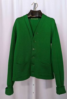 Vintage 40s 50s Green Athletic Knit Cardigan Leather Elbow USA Varsity. Great vintage condition, some wear to the cuffs, general wear, missing top button. Pit to pit: 19" Length: 23 1/2" Shoulders: 19" Shoulder to cuff: 24" Classic Green Wool Cardigan, Classic Cardigan With Pockets, Classic Cardigan With Pockets For Daywear, Vintage Solid Color Winter Cardigan, Vintage Wool Cardigan With Pockets, Vintage Cardigan For Winter, Vintage Green Cardigan With Button Closure, Green Vintage Cardigan With Buttons, Vintage Buttoned Cardigan For Work