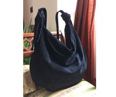 Hobo bag leather is comfortable and modern, will give a beautiful accent to your outfit and style. Suede bag women is soft and very roomy, for your best time. Hobo bag crossbody is made of genuine Italian suede, high quality and soft to the touch. Materials: - genuine Italian black suede - one magnetic clip - cotton fabric - zip  - resistant polyester 100% wire. Measurements: - width 15,75 inches (40 cm) - height 13 inches (33 cm) - shoulder strap length from knot to knot 37,40 inches (95 cm). S Memory Blanket, Soft Leather Handbags, Suede Bag, Hobo Bags, Handbag Leather, Leather Bag Women, Leather Hobo Bag, Hobo Handbags, Bag Women