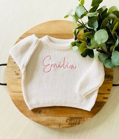 "PERSONALIZED BABY, TODDLER & KID'S EMBROIDERED KNIT SWEATER These customizable sweatshirts are such a beautiful piece to share with the littles in your life. They can also be used for pregnancy and birth announcements and, make an amazing baby shower or birthday gift too! ABOUT ME: *The lettering is unique to each sweatshirt and embroidered in the appropriate sizing. Each name is embroidered with a high-quality polyester embroidery thread. *Cold-wash and hang-to-dry for longevity.  SHIPPING:  *As this product is made to order, the current turnaround time is 3 weeks. Need your order, like, yesterday? No problem, we understand that these things happen, and we're here to help! Simply add our \"Rush My Order\" listing to your cart when you check out, and we'll put a lightning fast expedition Playful Long Sleeve Customizable Tops, Customizable Cute Long Sleeve Top, Cute Customizable Long Sleeve Top, Cute Crew Neck Birthday Sweater, Cute Crew Neck Sweater For Birthday, Customizable Cute Crew Neck Sweater, Cute Customizable Crew Neck Sweater, Cute Cotton Sweater For Birthday, White Sweater With Name Print For Fall