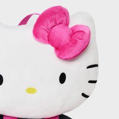 a hello kitty stuffed animal with a pink bow on it's head