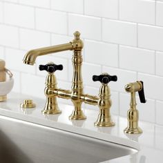 the faucet is gold and black in color, but it's not white