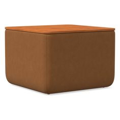 a brown ottoman that is sitting on the ground