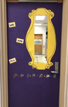 a purple door with yellow trim and the words friends painted on it in front of a mirror