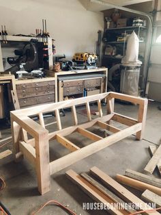 a bench made out of wood in a garage with workbench and tools on the table