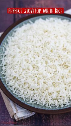 white rice is in a bowl on a table