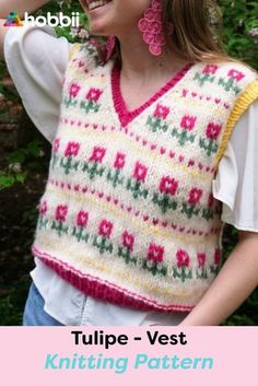 a woman wearing a sweater vest with flowers on it and the text tulip - vest, yarn design pattern