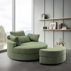 a green chair and ottoman in front of a window