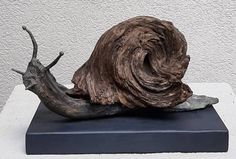 a close up of a sculpture of a snail