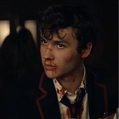 a man with blood all over his face