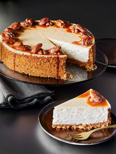 a cheesecake with nuts on top is sitting on a plate next to a fork