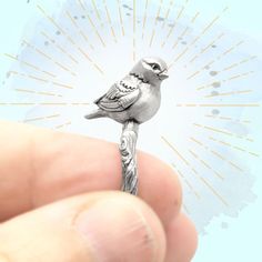 If you are looking a beautiful and fun gift for yourself or someone else, here it is!  This fully sculpted song bird is adorably perched upon it's little twig perch and your ring.  Made in solid sterling silver your ring is completely made in USA.  This is the larger of the 2 bird rings we have, and you can buy them individually or as a set!   Each of my pieces is digitally sculpted with much care.  This bird ring is completely sculpted, on all sides and the bottom, and is solid metal.  They are cast in the metal of your choice, and antiqued and polished by hand.  The metal is given a matte finish, which helps the intricate details stand out even more.  Each one is hand packed and send out from my home studio with love.  All of the metal used is 100% recycled metal, and all of the work and Pmc Rings, Silver Bird Ring, Bird Ring, Clay Bird, Bird Rings, Handwriting Jewelry, Silver Bird, Bird Gifts, Bird Jewelry