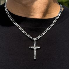 This elegant medium solid crucifix pendant is a timeless and versatile accessory that can be worn for any occasion. It is made of silver-plated alloy and comes with a 5mm Cuban chain or 4mm Rope chain. The pendant is approximately 1.5 inches wide and 2 inches long. Features: Chain Length - Cuban Chain- 22 inches - Rope Chaim- 20 inches - Material: Silver plated alloy - Dimensions: Approx. 1.5 inches width and 2 inches length - Includes: 5mm Cuban chain or 4mm Rope chain - A thoughtful gift for a Silver Crucifix Chain Jewelry, Silver Crucifix Figaro Chain Jewelry, Silver Crucifix Necklace With Figaro Chain, Silver Figaro Chain Necklace With Cross Pendant, Silver Cross Necklace With Figaro Chain As Gift, Silver Necklace With Figaro Chain And Cross Pendant, Silver Cross Necklace With Figaro Chain, Rope Necklace, Cuban Chain