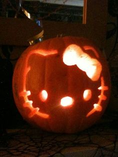 a pumpkin carved to look like hello kitty