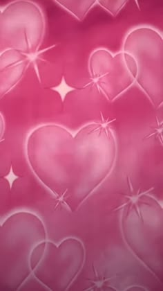 pink hearts with stars and sparkles in the background